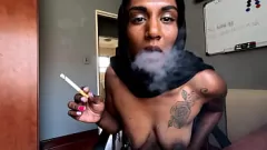 Play Desi in Hijab Smokes with Nipple Clamps & Fishnet Stockings