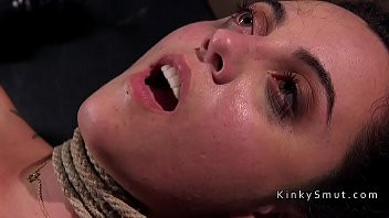 Play Hogtied and suspended brunette spanked